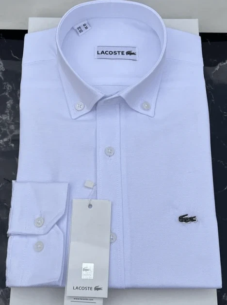 Chemise manches longues Lacoste — vente en gros quantité minimum : 12 pièces • prix grossiste : 5 500 – 6 000 FCFA / pièce